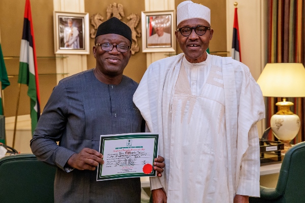 0_1532022470897_Fayemi presents certificate of return to Buhari.jpg