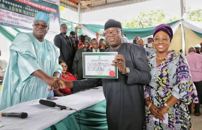 0_1533623596084_Fayemi-with-his-wife-Bisi-receives-the-Certificate-of-Return-from-INEC-National-Commissioner.jpg