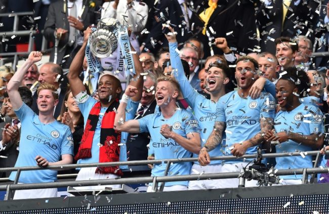 0_1558230571195_Manchester-City-players-win-the-FA-Cup-to-complete-a-domestic-treble.jpg