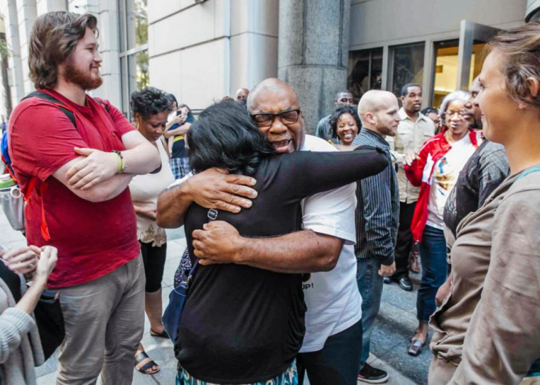 0_1528372598407_Anthony-Wright’s-father-David-Parker-hugs-a-family-member-after-the-verdict.jpg